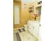 Bathroom with marble floors, a white vanity, modern hardware and neutral paint at 12406 Beacontree Way, Orlando, FL 32837