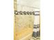 Bathroom with a tub and shower combo featuring decorative tile and shower curtain at 12406 Beacontree Way, Orlando, FL 32837