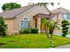 Attractive home displaying mature landscaping, a well-maintained lawn, and plenty of curb appeal at 12406 Beacontree Way, Orlando, FL 32837