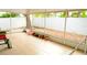 Enclosed patio featuring tile flooring and ample natural light, perfect for relaxation at 12406 Beacontree Way, Orlando, FL 32837