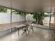 Screened-in lanai with tile flooring and an outdoor seating area, ideal for entertaining at 12406 Beacontree Way, Orlando, FL 32837