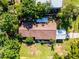Stunning aerial view of the house showing its backyard, trees, and surrounding landscape at 1250 Tangerine Ct, Eustis, FL 32726