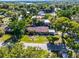 Aerial view of the residence in a green area with trees around at 1250 Tangerine Ct, Eustis, FL 32726