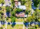 Aerial view showcasing the property within a community setting and its surrounding greenery at 1250 Tangerine Ct, Eustis, FL 32726