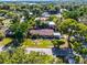 Aerial view of a charming home with well-manicured lawn surrounded by a property line at 1250 Tangerine Ct, Eustis, FL 32726