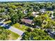 Scenic aerial view of property nestled within lush greenery, with surrounding neighborhood views at 1250 Tangerine Ct, Eustis, FL 32726