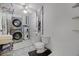 Laundry utility bathroom with washer, dryer, toilet, and sink at 1250 Tangerine Ct, Eustis, FL 32726