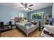 Cozy bedroom with ceiling fan, window, and comfortable bed at 1250 Tangerine Ct, Eustis, FL 32726