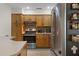 Functional kitchen featuring wooden cabinets, stainless steel appliances, and tiled backsplash at 1250 Tangerine Ct, Eustis, FL 32726