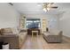 Inviting living room featuring comfortable furniture, neutral tones, and tile flooring at 1250 Tangerine Ct, Eustis, FL 32726