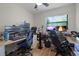 Office/Bedroom with two computer desk stations, ceiling fan, and natural light at 1250 Tangerine Ct, Eustis, FL 32726