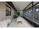 Enclosed patio with a table set, and open backyard at 1250 Tangerine Ct, Eustis, FL 32726