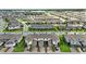 An aerial view of attached homes with garages and brick paved driveways in a Primary-planned community at 13293 Pontoon Rd, Winter Garden, FL 34787