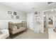 Brightly decorated bedroom with neutral color scheme and gold crib at 13293 Pontoon Rd, Winter Garden, FL 34787
