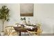 Cozy dining area with a round wooden table, seating for four, and stylish decor at 13293 Pontoon Rd, Winter Garden, FL 34787