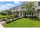 Beautiful townhome with lush landscaping and well-maintained lawn at 13293 Pontoon Rd, Winter Garden, FL 34787