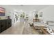 Bright living space featuring tile floors, modern decor, and an open floor plan flowing into the kitchen at 13293 Pontoon Rd, Winter Garden, FL 34787