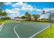 Enjoy the community basketball court with a shaded seating area on a sunny day at 1356 Scarlet Oak Loop, Winter Garden, FL 34787