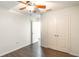 This bright bedroom features wood-look floors and a ceiling fan. Double doors access an ample closet at 1356 Scarlet Oak Loop, Winter Garden, FL 34787