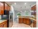 Well-equipped kitchen featuring modern appliances, granite countertops, and ample cabinet space at 1356 Scarlet Oak Loop, Winter Garden, FL 34787