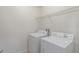 The laundry room includes a washer, a dryer, and a wire shelf at 1356 Scarlet Oak Loop, Winter Garden, FL 34787