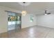 The living room has sliding glass doors that provide access to the screened-in outdoor patio at 1356 Scarlet Oak Loop, Winter Garden, FL 34787