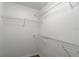 Walk-in closet with a white interior, shelving, and wood-look flooring at 1356 Scarlet Oak Loop, Winter Garden, FL 34787