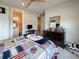 Bedroom with a window, neutral walls, and view to the ensuite bath at 13617 Haulover Beach Ln, Orlando, FL 32827