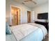 Bedroom with TV, view to ensuite bathroom, and neutral walls at 13617 Haulover Beach Ln, Orlando, FL 32827