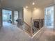 Bright hallway features wood and iron stair railings, leading to adjacent living spaces at 13617 Haulover Beach Ln, Orlando, FL 32827