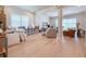 Spacious living room with hardwood floors, bar seating and an open concept layout at 13617 Haulover Beach Ln, Orlando, FL 32827