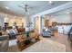 Spacious living room with hardwood floors, a comfortable seating area, and an open layout connecting to the kitchen at 13617 Haulover Beach Ln, Orlando, FL 32827
