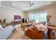 Inviting living room with a comfortable seating arrangement, large windows overlooking the pool, and modern decor at 13617 Haulover Beach Ln, Orlando, FL 32827