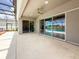 Screened-in patio featuring ceiling fan, tile floors, and sliding glass doors leading to an outdoor pool area at 13617 Haulover Beach Ln, Orlando, FL 32827