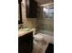 Bathroom featuring a shower and tub, a granite countertop with a sink, and modern fixtures at 13785 Se 39Th Ter, Summerfield, FL 34491
