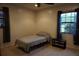 Well-lit bedroom with neutral carpet and two windows offering natural light at 13785 Se 39Th Ter, Summerfield, FL 34491