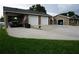 This house has a large driveway leading to a two-car garage at 13785 Se 39Th Ter, Summerfield, FL 34491