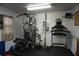 Private home exercise room featuring universal gym, treadmill, and weight lifting equipment at 13785 Se 39Th Ter, Summerfield, FL 34491