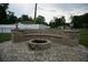 Outdoor fire pit featuring stone patio and circular stone seating at 13785 Se 39Th Ter, Summerfield, FL 34491