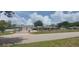 Charming home featuring a private gate entrance and meticulously maintained landscaping at 13785 Se 39Th Ter, Summerfield, FL 34491