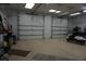 Spacious garage featuring two car doors and ample room for parking and storage at 13785 Se 39Th Ter, Summerfield, FL 34491