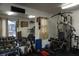 Well-equipped gym with machines, free weights, and mirrored wall to keep up with your exercise routine at 13785 Se 39Th Ter, Summerfield, FL 34491