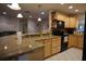 Open kitchen design with granite countertops, breakfast bar, and stainless steel appliances at 13785 Se 39Th Ter, Summerfield, FL 34491