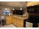 Spacious kitchen with breakfast bar, lots of cabinetry, and updated appliances at 13785 Se 39Th Ter, Summerfield, FL 34491