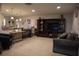 Open concept living room with a tv, cozy seating, and view of the bar and dining area at 13785 Se 39Th Ter, Summerfield, FL 34491