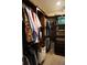 Spacious walk-in closet with custom shelving and drawers for optimal storage at 13785 Se 39Th Ter, Summerfield, FL 34491