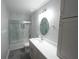 Bathroom with a glass shower, vanity, and a mirror at 14308 Abington Heights Dr, Orlando, FL 32828