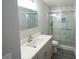 Updated bathroom with marble tile shower and modern vanity at 14308 Abington Heights Dr, Orlando, FL 32828