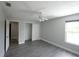 Bedroom with hardwood floor, a closet, and an entrance to another room at 14308 Abington Heights Dr, Orlando, FL 32828