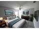 The bedroom features a bed, a ceiling fan, and a television at 14308 Abington Heights Dr, Orlando, FL 32828
